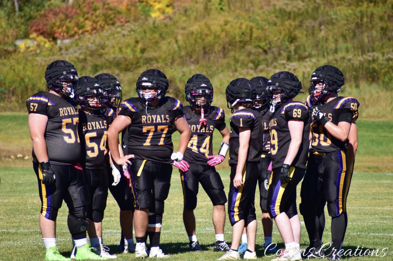 Mascoma Royals football players standing together on the field during the Newfound game